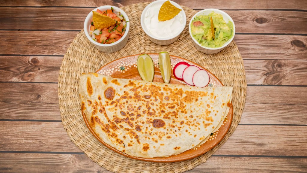 Quesadilla plate with pico de gallo, sour cream, and guacamole at Margaritas Tacos in Island Park, NY